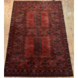 An Afghan style rug of typical design and palette 300cm x 201cm