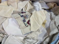 A large collection of miscellaneous linens, such as embroidered napkins, pillow cases, table