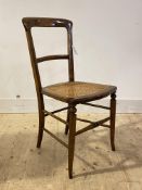 An early 20th century stained beech side chair with cane seat panel, H84cm