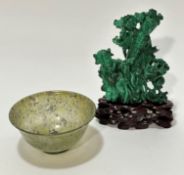 A modern Chinese jadeite bowl of mottled spinach and celadon colour, (5cm x 10cm) and a Chinese