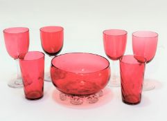 A cranberry glass circular rose bowl raised on crimped stand (8cm x 13cm), a pair of spiral