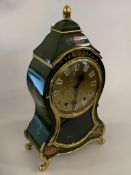 A reproduction mantel clock of cartouche form, twin train movement, H32cm