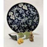 A Japanese circular plate decorated with cherry blossom design, seal mark verso (d 24cm), a resin