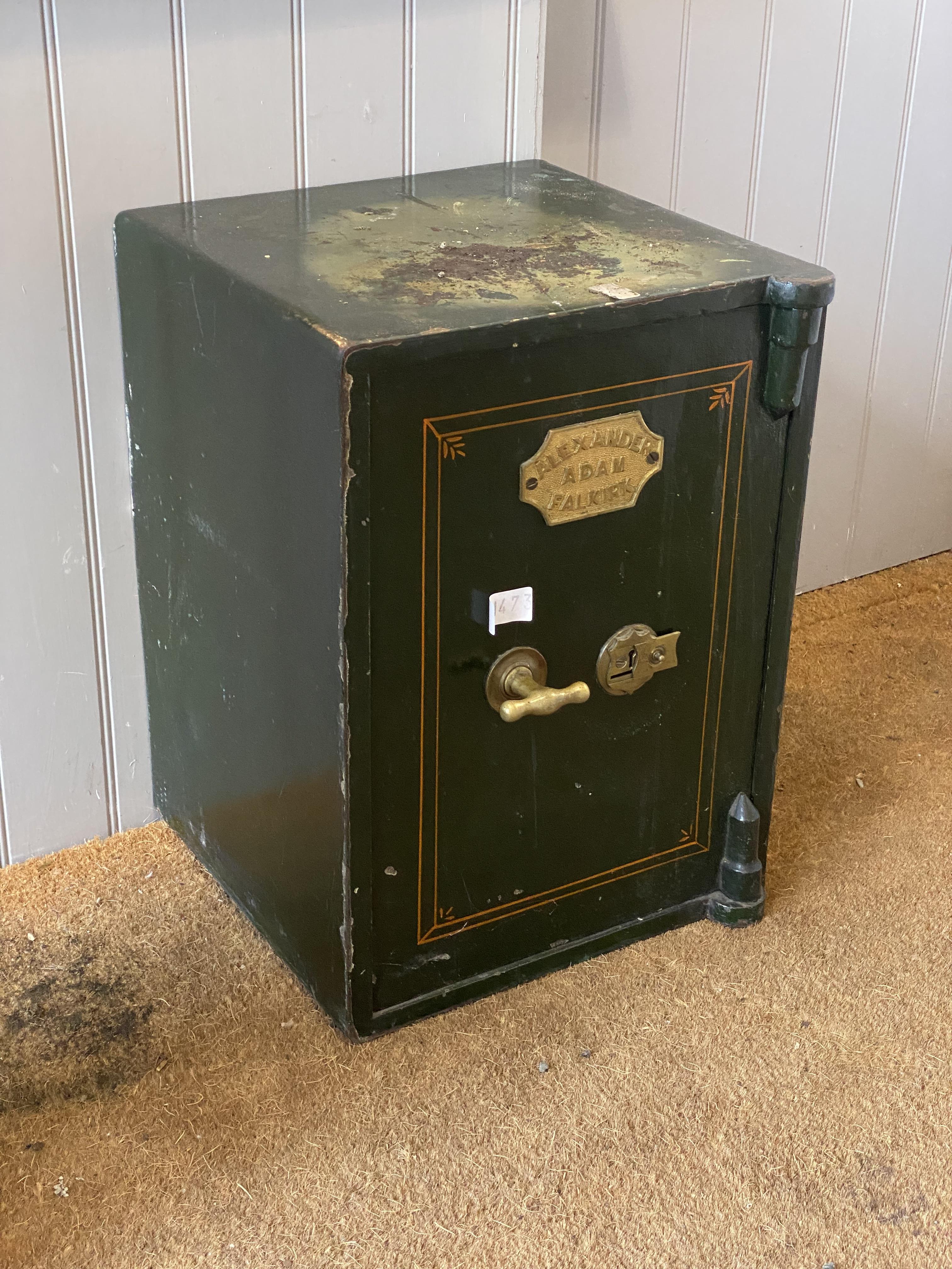 A 19th century cast iron and green painted safe, the door with brass plaque inscribed by makers