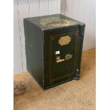 A 19th century cast iron and green painted safe, the door with brass plaque inscribed by makers
