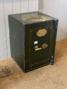 A 19th century cast iron and green painted safe, the door with brass plaque inscribed by makers