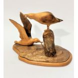 E Summers, Blacked Back Gulls, a treen carving (20cm x 28cm x 14cm), signed verso and dated 1999
