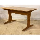 An Arts and Crafts style varnished beech trestle end dining table, H81cm, 153cm x 85cm