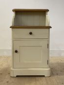 An oak and cream painted bedside, with open shelf over drawer and cupboard, H82cm