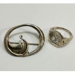 An oval Viking long boat open work brooch stamped verso Sterling Silver, makers mark OMG, and a