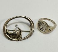 An oval Viking long boat open work brooch stamped verso Sterling Silver, makers mark OMG, and a