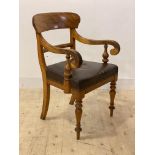 A Victorian satinwood captains chair, with scrolled open arms, skivered seat, raised on turned