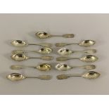 A set of 11 Sheffield silver shell and fiddle pattern grapefruit spoons by walker and hall, 251g
