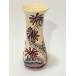 A Moorcroft Collectors Club daisy pattern tapered cylinder vase decorated with tube lined and