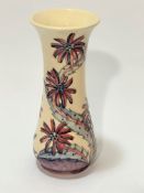 A Moorcroft Collectors Club daisy pattern tapered cylinder vase decorated with tube lined and