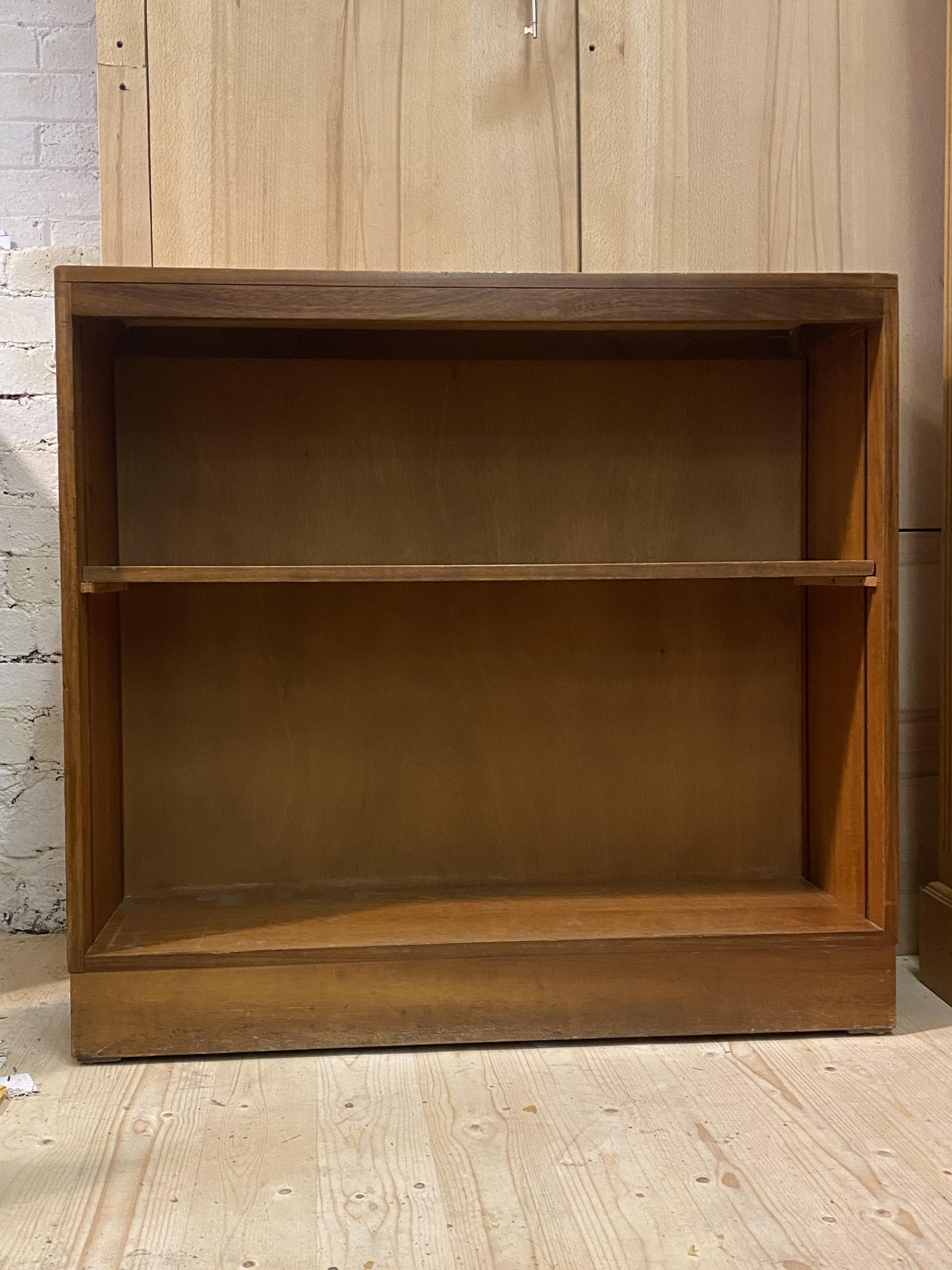 A mid 20th century teak open bookcase, fitted with one fixed shelf, (Alterations) H93cm, W100cm,