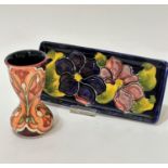 A William Moorcroft pottery rectangular dish decorated with clematis design and blue ground, (2cm