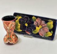 A William Moorcroft pottery rectangular dish decorated with clematis design and blue ground, (2cm