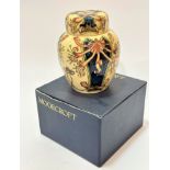 A Moorcroft ginger jar decorated with honeysuckle design, buff ground, signed verso WM and dated 9/