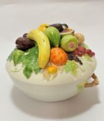 An Italian Dipinto Mano china tureen and cover with encrusted fruit including bananas, quinces,