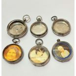 A collection of six various silver pocket watch cases, used as photograph mounts, (largest d 5cm,