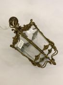 An Edwardian floral cast gilt brass hall lantern of tapered hexagonal form, with six etched glass