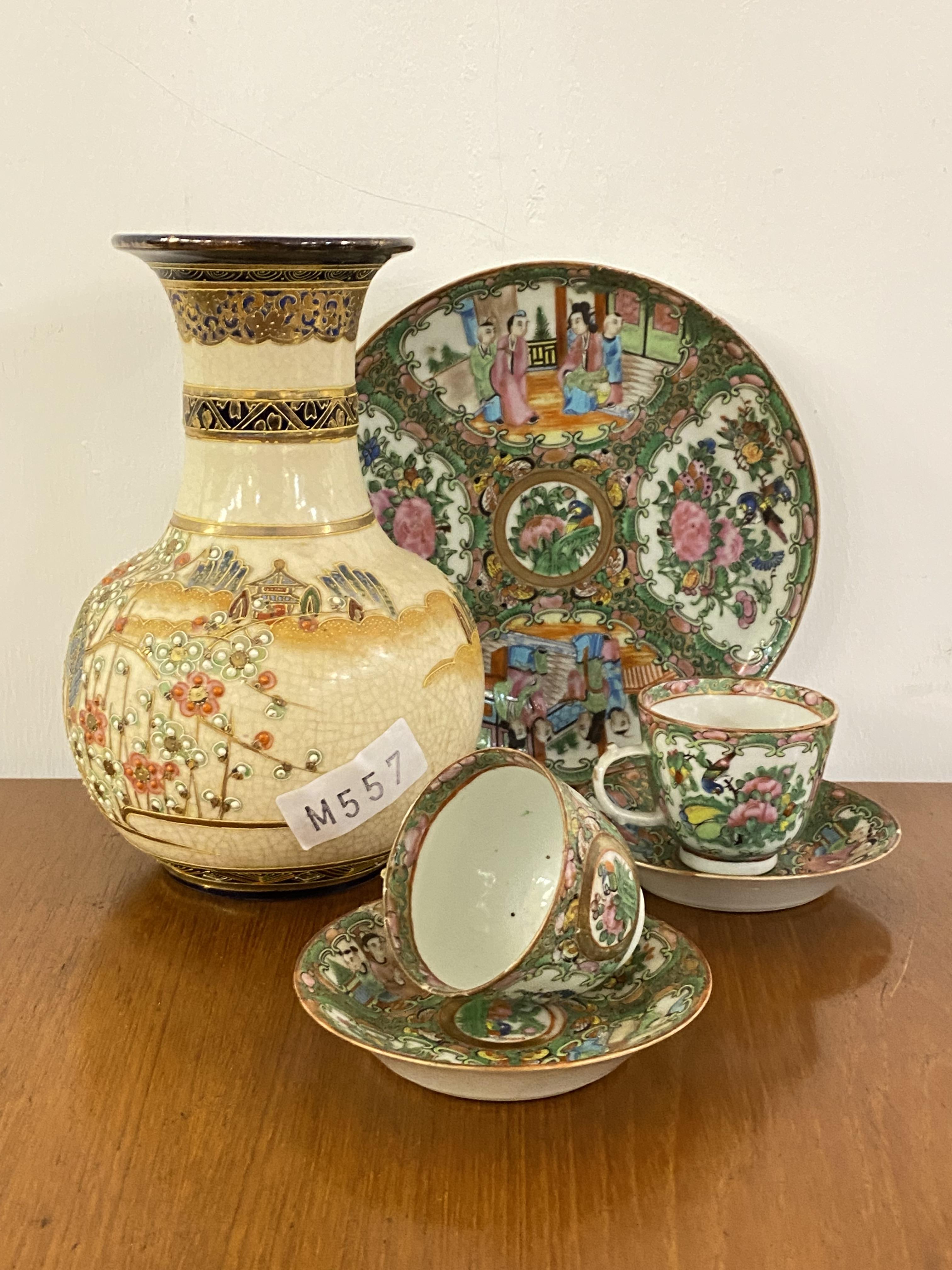 A pair of 19th century Canton Famille Rose teacups and saucers, and a serving plate, together with a