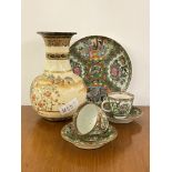 A pair of 19th century Canton Famille Rose teacups and saucers, and a serving plate, together with a