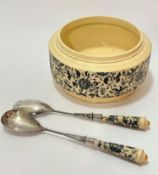 An Edwardian stoneware salad bowl and pair of Epns salad servers decorated with incised