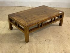 A Chinese hardwood Kang table, late 19th / early 20th century, the rectangular panelled top raised