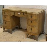 A bleached bur walnut 18th century style serpentine front knee hole desk or dressing table, fitted