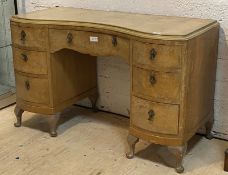 A bleached bur walnut 18th century style serpentine front knee hole desk or dressing table, fitted