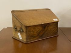 A late 19th century figured walnut stationary casket, the sloped top lifting to reveal interior