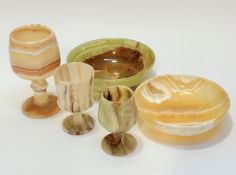 A group of three graduated alabaster goblets of various forms and two alabaster circular bowls, (