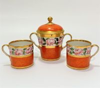 A pair of early 19thc porcelain coffee cans decorated with handpainted rose and gilt border with