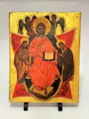 A modern Russian icon depicting Christ with Saints and angels, decorated with gilt reserve, on