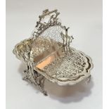 An Edwardian Epns fan shell design two division folding muffin dish on rustic stand, (26cm x 20cm)