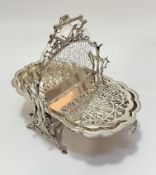 An Edwardian Epns fan shell design two division folding muffin dish on rustic stand, (26cm x 20cm)