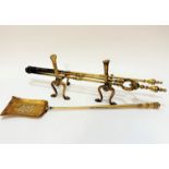 A collection of brass fire companions comprising iron, guards, shovel, poker etc.