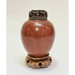 A 19thc Chinese peach bloom pottery ginger jar of ovoid form, (13cm x 11cm) complete with pierced