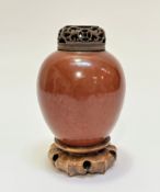 A 19thc Chinese peach bloom pottery ginger jar of ovoid form, (13cm x 11cm) complete with pierced