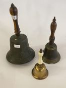 A large Victorian brass school bell with turned handle (H38cm) together with two other bells, one
