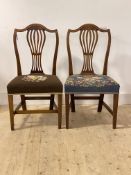 A pair of late Georgian mahogany chairs, with shaped crest rail over pierced splat back,