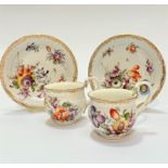 A pair of late 19thc Meissen porcelain cabinet cups decorated with handpainted tulip and rose and