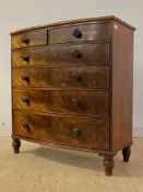 A mid 19th century mahogany bow front chest, fitted with two short and four long graduated drawers