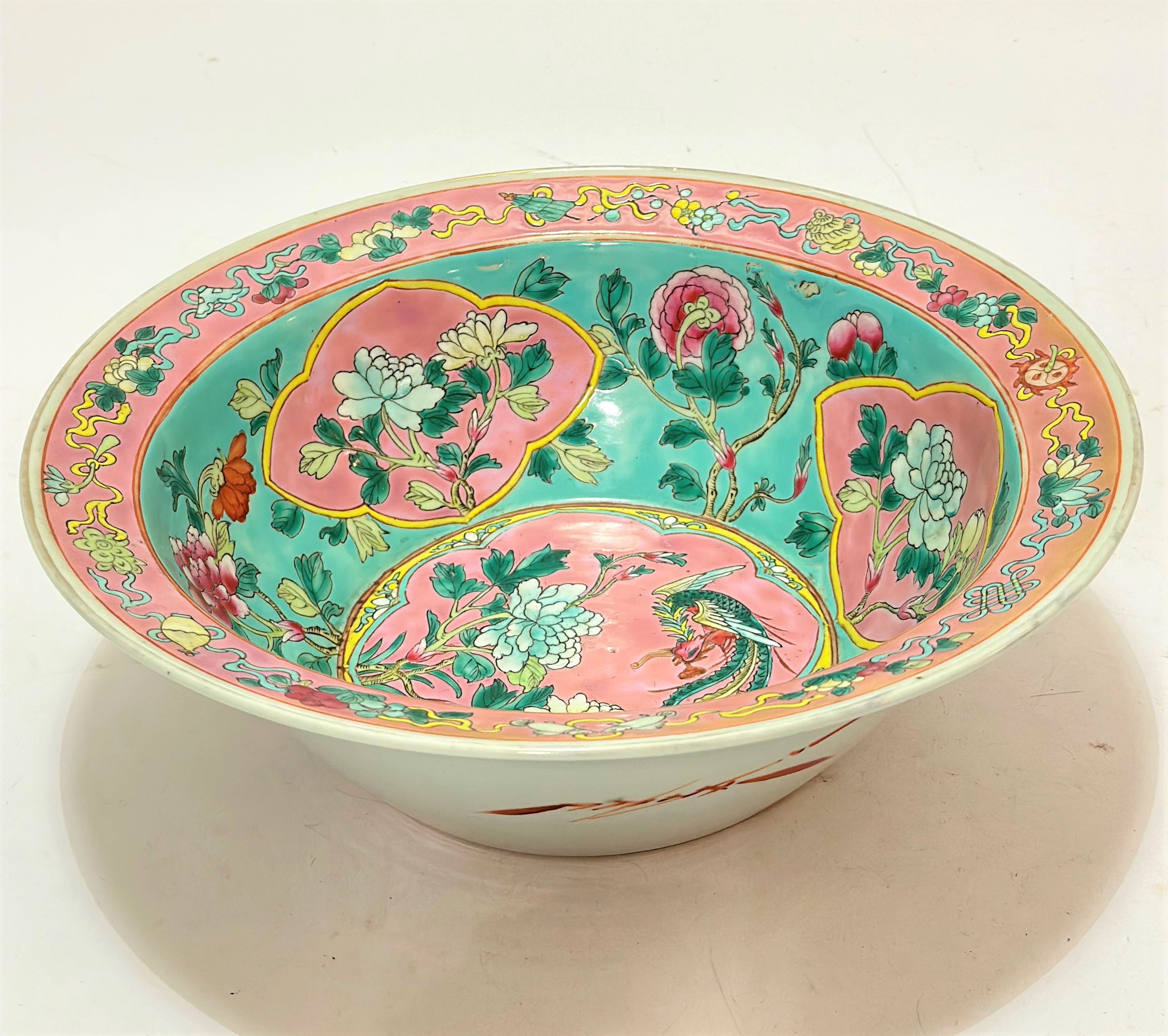 A modern chinese bowl of flared tapered form decorated with exotic bird and chrysanthemum design