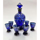 An Italian blue glass seven piece set of glassware including a baluster decanter complete with