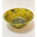 A Chinese spinach style jadeite bowl (7cm x 18cm)