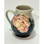 A Moorcroft Collectors Club jug, impressed mark verso and painted WM, decorated with cabbage rose