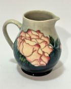 A Moorcroft Collectors Club jug, impressed mark verso and painted WM, decorated with cabbage rose